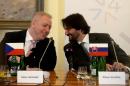 Czech Interior Minister Milan Chovanec (L) talks with his Slovak counterpart Robert Kalinak during the press conference after their V4 Visegrad Group Interior Minister's meeting in Prague on January 19, 2016
