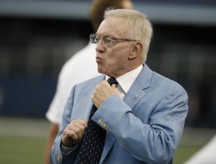 Would Jerry Jones be willing to hire a coach with no NFL experience? (AP)