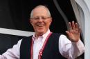 Peruvian presidential candidate Pedro Pablo Kuczynski waves to followers from his house, in Lima