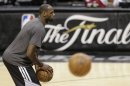 Miami Heat's LeBron James takes part in NBA basketball practice Wednesday, June 12, 2013, in San Antonio. The Heat trail the San Antonio Spurs 2-1 in the best-of-seven games series. Game 4 of the NBA finals series is scheduled for Thursday. (AP Photo/Eric Gay)