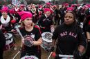 Roused by fiery speeches and led by women in pink "pussyhats," hundreds of thousands flooded Washington and cities across the US to protest President Donald Trump