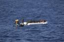 In this photo provided by the Swedish Coast Guard, a tug boat from the ship Poseidon reaches a rubber boat with 130 migrants off the Libyan coast Wednesday, Aug. 26, 2015. The Swedish ship Poseidon immediately after rescued 439 survivors aboard a wooden ship, discovering in the hull the corpses of 51 migrants who died, probably of asphyxiation, making the dangerous Mediterranean crossing in hopes of reaching Europe. (Swedish Coast Guard via AP Photo) MANDATORY CREDIT