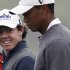 FILE - This Oct. 29, 2012 file photo shows Tiger Woods, right, and Rory McIlroy walking together during their 18-hole medal-match at the Lake Jinsha Golf Club in Zhengzhou, in central China's Henan province. A little more than three months ago, Woods was on his way back to the top of golf with only time in his way. So much has changed. (AP Photo/Alexander F. Yuan, File)