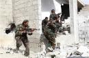 Shi'ite fighters, who support Syrian President Bashar al-Assad, search for rebels from house to house in the countryside near Damascus
