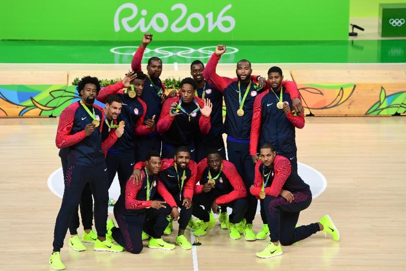 From L: The members of the USA men's basketball team celebrate with their gold medals (AFP Photo/Emmanuel Dunand)