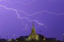 AP10ThingsToSee - Lightning steaks across the sky behind the Young Meadows Presbyterian Church in Montgomery, Ala., Monday, March 18, 2013. Strong storms moved across much of Alabama on Monday, bringing hail, high winds, and heavy rainfall as a cold front passed through the state. (AP Photo/Dave Martin, File)