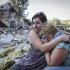 Samokhval, daughter of Khlystov, embraces her crying mother in front of their partially demolished house in the Black Sea city of Sochi