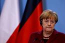 FILE PHOTO: German Chancellor Angela Merkel attends a press conference in Warsaw