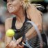 Sharapova of Russia returns the ball to Errani of Italy during their women's singles final match at the French Open tennis tournament at the Roland Garros stadium in Paris