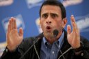 Opposition presidential candidate Henrique Capriles speaks during a news conference in Caracas, Venezuela, Tuesday, June 26, 2012. Capriles will challenge Venezuela's President Hugo Chavez in the presidential elections scheduled for Oct. 7. (AP Photo/Ariana Cubillos)