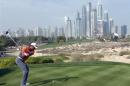 Woods of the U.S.takes a shot on the 8th tee during the third round of the 2014 Omega Dubai Desert Classic in Dubai