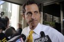 New York City mayoral candidate Anthony Weiner leaves his apartment building in New York on Wednesday, July 24, 2013. The former congressman acknowledged sending explicit text messages to a woman as recently as last summer, more than a year after sexting revelations destroyed his congressional career. (AP Photo/Richard Drew)