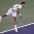 Novak Djokovic of Serbia serves against Fabio Fognini of Italy during their match at the BNP Paribas Open ATP tennis tournament in Indian Wells, California