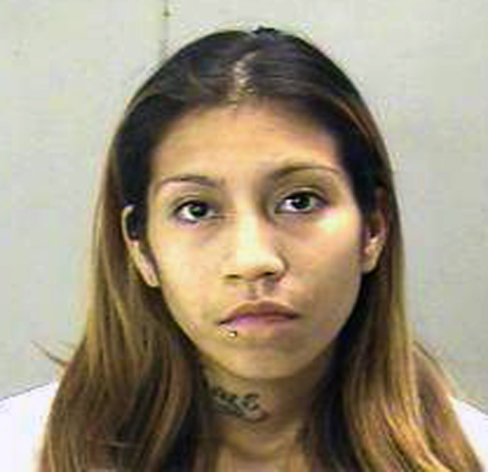 FILE - This undated file handout photo from the Dallas County Sheriff's Department shows Elizabeth Escalona who admitted to beating her 2-year-old daughter and gluing her hands to a wall. Escalona pleaded guilty July 12, 2012 to injury to a child. The young mother is scheduled to be sentenced Monday, Oct. 8, 2012, and faces up to life in prison. (AP Photo/Dallas County Sheriff's Department)