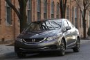 A 2013 Honda Civic is shown in Detroit, Tuesday, Nov. 27, 2012. Just 19 months after its Civic compact car hit showrooms and got slammed by critics, the company has revamped the vehicle, giving it a new look and upgrading the interior. (AP Photo/Paul Sancya)