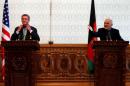Afghanistan's President Ashraf Ghani speaks during a joint news conference with U.S. Defense Secretary Ashton Carter (L) in Kabul