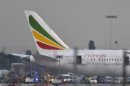 Emergency services attend to a Boeing 787 Dreamliner, operated by Ethiopian Airlines, after it caught fire at Britain's Heathrow airport