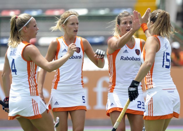 The Netherlands&#39; Kim Lammers (2-R) celebrates with teammates Sabine Mol (R), Carlien Dirkse (2-L) and Kitty Van Male after scoring the team&#39;s first goal against Japan during their Champions Tr