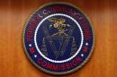 The Federal Communications Commission (FCC) logo is seen before the FCC Net Neutrality hearing in Washington