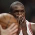 Bulls' Deng pauses during a break in play against the Heat during Game 5 of their NBA Eastern Conference Finals playoff basketball game in Chicago