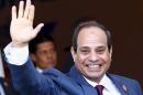 Egyptian President al-Sisi waves as he arrives to opening ceremony of New Suez Canal, in Egypt