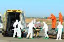 Aid workers and doctors transfer Roman Catholic priest Miguel Pajares, who contracted the deadly Ebola virus, and Spanish nun Juliana Bonoha Bohe from Madrid's Torrejon air base to a hospital, August 7, 2014