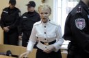 FILE - Former Ukrainian Prime Minister Yulia Tymoshenko during a trial hearing at the Pecherskiy District Court in Kiev, Ukraine, in this file photo dated Wednesday, June 29, 2011. Europe's human rights court in Strasbourg, France, ruled Tuesday April 30, 2013, that Ukraine's jailing of former Prime Minister Yulia Tymoshenko was a politically motivated violation of her rights, but it is unclear if the European court ruling would be legally binding in Ukraine. (AP Photo/Sergei Chuzavkov, File)