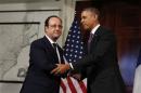 U.S. President Barack Obama and French President Francois Hollande shake hands in Charlottesville