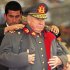 FILE - In this Aug. 23, 1995 file photo, former Chilean dictator and military commander Gen. Augusto Pinochet is helped by a bodyguard to put on his coat during a military ceremony in Santiago, Chile, on the occasion of the 22nd anniversary of his taking the post as head of the Chilean armed forces.  Months after his appointment in 1973, Pinochet led the coup that ousted President Salvador Allende. Pinochet sympathizers will honor the former strongman on Sunday, June 10, 2012 with the screening of a new documentary about his dictatorship years in a Santiago theater. (AP Photo/Santiago Llanquin, File)