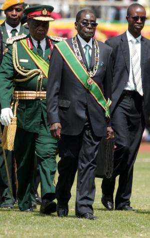 Zimbabwe ruler Robert Mugabe (C) in Harare on April …