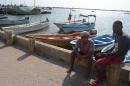 This picture taken on June 18, 2014, shows local tour guides siting while waiting for clients in Lamu