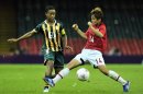 South Africa's midfielder Amanda Dlamini (L) fights for the ball with Japan's midfielder Asuna Tanaka