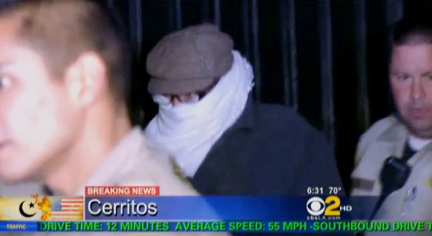FILE - In this Sept. 15, 2012 file image from video provided by CBS2-KCAL9, Nakoula Basseley Nakoula, the man behind a crudely produced anti-Islamic video that has inflamed parts of the Middle East, is escorted by Los Angeles County sheriff's deputies from his home in Cerritos, Calif. Nakoula, 55, was arrested Thursday for violating terms of his probation, authorities said. (AP Photo/CBS2-KCAL9, File) MANDATORY CREDIT CBS-KCAL9, LOS ANGELES OUT, LOS ANGELES TV OUT