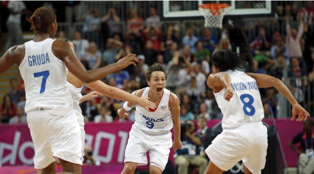 France's Dumerc celebrates her game winning shot against Great Britain during game against France at their women's preliminary round Group B basketball match at the Basketball Arena during the London 