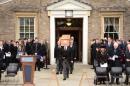 The oak coffin containing the remains of King Richard III, the last king on England's Plantagenet dynasty, is carried for a service outside the University of Leicester in Leicester, central England on March 22, 2015, ahead of his reburial