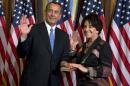 FILE - In this Jan. 3, 2013, file photo, Rep. Anna Eshoo, D-Calif., right, participates in a mock swearing-in ceremony with House Speaker John Boehner, R-Ohio, for the 113th Congress in Washington. Cloistered in a tense, private Capitol Hill meeting for House Democrats this month, Eshoo had some advice for the aides to President Barack Obama who were trying, with questionable success, to assure the unhappy caucus present that the woeful web site for the president's signature health care law would soon be working. In fact, they pledged, by Nov. 30, the "vast majority" of Americans who try to buy policies on the "Obamacare" will succeed. Stop setting "red lines" that might be broken, Eshoo told the presidential aides, according to a person present who was not authorized to release the exchange. (AP Photo/ Evan Vucci, File)