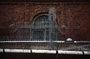 Barbed wire secures the prison Moabit where Canadian Luka Magnotta is kept in Berlin, Germany, Wednesday, June 6, 2012. Luka Magnotta, 29, a Canadian porn actor suspected of murdering and dismembering a Chinese was arrested on Monday at an Internet cafe. (AP Photo/Markus Schreiber)