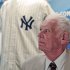 FILE - In this June 28, 2012, file photo, New York Yankees great Don Larsen reacts during a news conference announcing the auction of his 1956 perfect game uniform in New York. Larsen is auctioning off the Yankee pinstripes he wore in 1956 when he pitched the only perfect game in World Series history, and will use the proceeds to pay college tuition for his grandchildren, one in college and the other a high school freshman. (AP Photo/Bebeto Matthews, File)