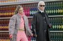 German designer Lagerfeld and model Delevingne appear at the end of his Fall/Winter 2014-2015 women's ready-to-wear collection show for French fashion house Chanel at the Grand Palais transformed into a "Chanel Shopping Center" during Paris Fashion Week