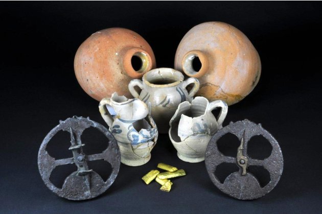 Handout photo of bronze astrolabes, gold bars, olive jars and Andalusian tablewares recovered from the Tortugas shipwreck, in the Straits of Florida
