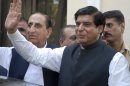 FILE -- In this Friday, June 22, 2012 file photo, Pakistan's Prime Minister Raja Pervaiz Ashraf waves in Islamabad, Pakistan. Pakistan's Supreme Court has ordered the arrest of the country's prime minister as part of a corruption case involving private power stations, officials said Tuesday, Jan. 15, 2013. (AP Photo/B.K. Bangash, File)