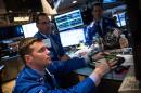 Traders work on the floor of the New York Stock Exchange during the afternoon of June 11, 2014