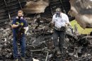 Handout photo of NTSB investigators retrieving recorders from the wreckage of UPS flight 1354 in Birmingham