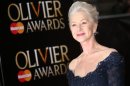 Helen Mirren poses on arrival at the Olivier Awards 2013 at the Royal opera House in London on Sunday, April 28, 2013. (Photo by Joel Ryan/Invision/AP)
