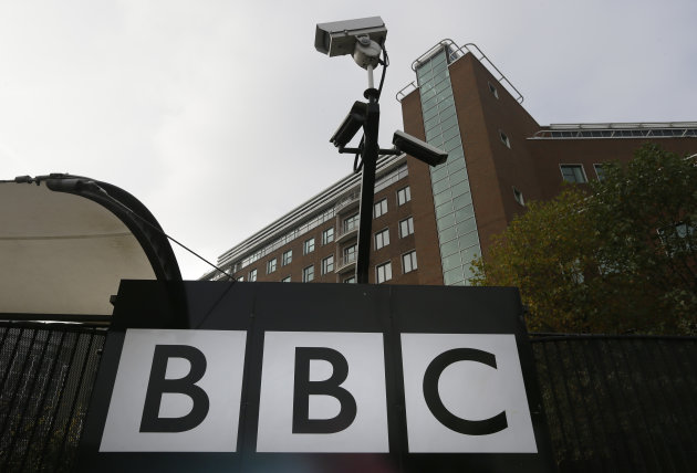 Cameras are seen above a sign at the BBC Television Centre, in London Wednesday, Oct. 24, 2012. The BBC is facing questions over sexual abuse allegations against former television presenter Jimmy Savile. (AP Photo/Kirsty Wigglesworth)
