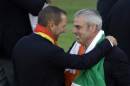 Europe team captain Paul McGinley, right, holds the trophy and talks to Sergio Garcia after winning the 2014 Ryder Cup golf tournament at Gleneagles, Scotland, Sunday, Sept. 28, 2014. (AP Photo/Matt Dunham)