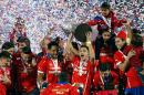 Chile's Alexis Sanchez lifts the trophy after winning the Copa America final soccer match against Argentina at the National Stadium in Santiago, Chile, Saturday, July 4, 2015. Chile defeated Argentina 4-1 in a penalty shoot out after the game ended in a 0-0 draw. (AP Photo/Andre Penner)