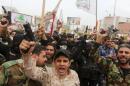 Protesters shout slogans during a demonstration against Turkish military deployment in Iraq, in Basra province