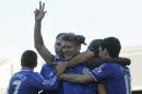 Chelsea's Andre Schurrle, center, celebrates his third goal against Fulham with teammates during their English Premier League soccer match at Craven Cottage, London, Saturday, March 1, 2014. (AP Photo/Sang Tan)