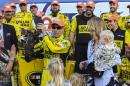 Matt Kenseth holds a lobster in Victory Lane after winning the NASCAR Sprint Cup series auto race at New Hampshire Motor Speedway in Loudon, N.H., Sunday, Sept. 27, 2015, (AP Photo/Cheryl Senter)